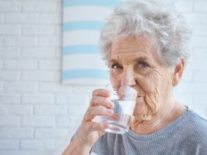 Senior woman drinking water