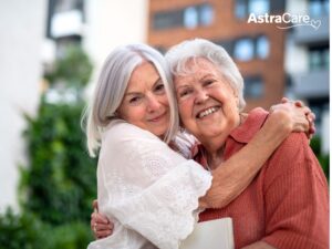 Woman hugging her senior mother, both smiling